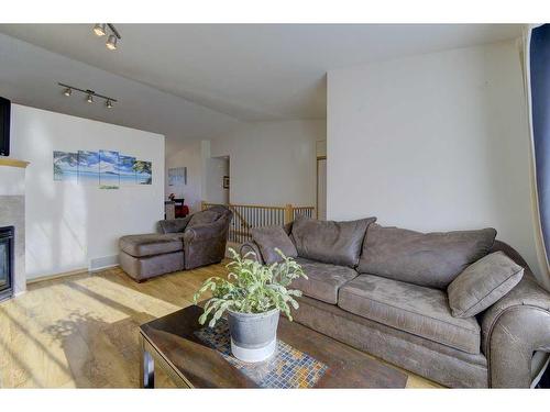 120 Lancaster Drive, Red Deer, AB - Indoor Photo Showing Living Room With Fireplace