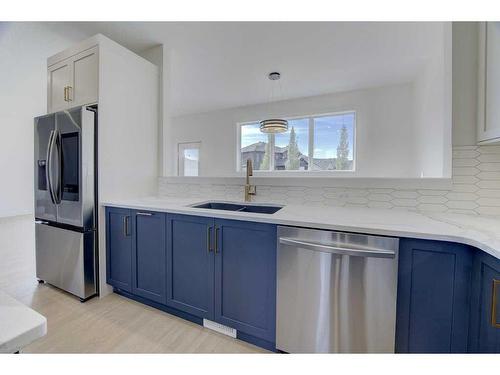 54 Lindman Avenue, Red Deer, AB - Indoor Photo Showing Kitchen With Double Sink