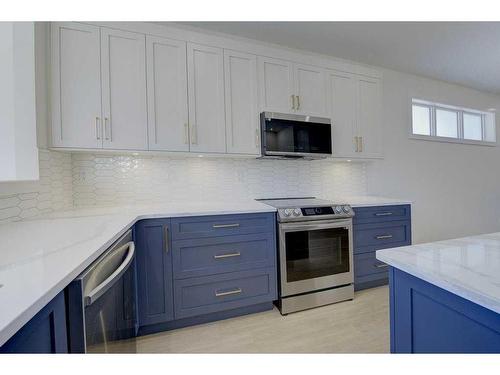 54 Lindman Avenue, Red Deer, AB - Indoor Photo Showing Kitchen With Upgraded Kitchen