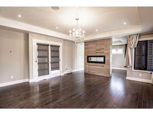 297 Jarvis Glen Way, Jarvis Bay, AB - Indoor Photo Showing Living Room With Fireplace