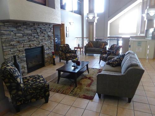 105-4805 45 Street, Red Deer, AB - Indoor Photo Showing Living Room With Fireplace