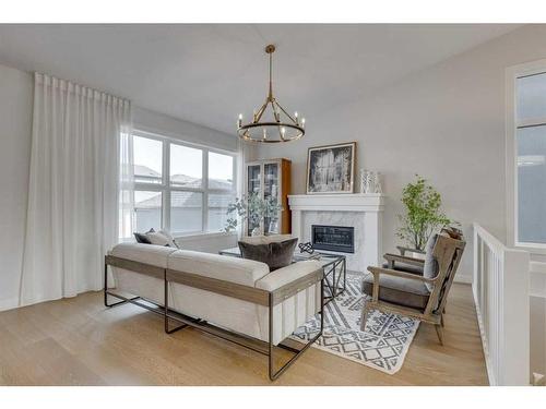 12 Treeline Lane Sw, Calgary, AB - Indoor Photo Showing Living Room With Fireplace