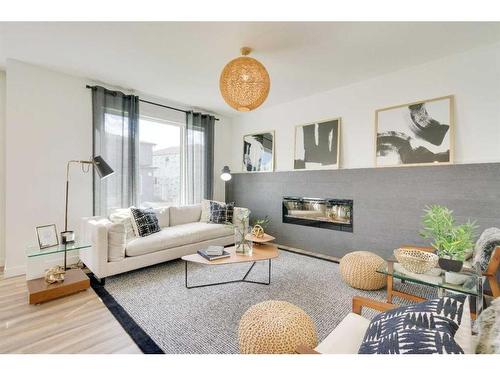 348 Sora Terrace Se, Calgary, AB - Indoor Photo Showing Living Room With Fireplace