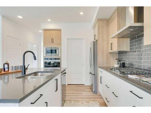 348 Sora Terrace Se, Calgary, AB - Indoor Photo Showing Kitchen With Double Sink With Upgraded Kitchen