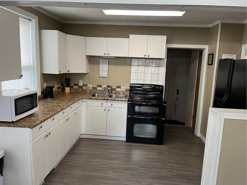 4936 48 Street, Rocky Mountain House, AB - Indoor Photo Showing Kitchen With Double Sink