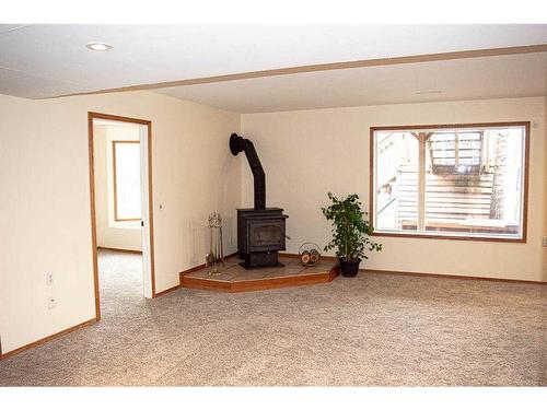 145-37411 Waskasoo Avenue, Rural Red Deer County, AB - Indoor With Fireplace