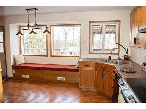 145-37411 Waskasoo Avenue, Rural Red Deer County, AB - Indoor Photo Showing Kitchen With Double Sink