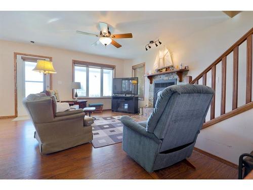 27 Lakeshore Drive, Sundance Beach, AB - Indoor Photo Showing Living Room With Fireplace