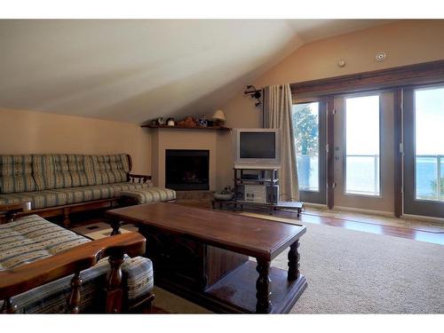 27 Lakeshore Drive, Sundance Beach, AB - Indoor Photo Showing Living Room With Fireplace