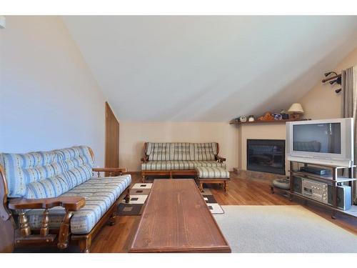 27 Lakeshore Drive, Sundance Beach, AB - Indoor Photo Showing Living Room With Fireplace