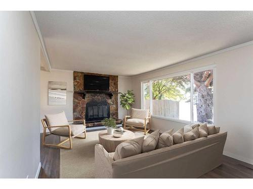 5659 76 Street, Red Deer, AB - Indoor Photo Showing Living Room With Fireplace