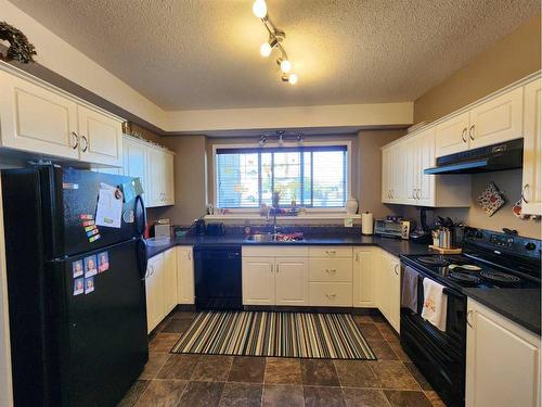 91 Isherwood Close, Red Deer, AB - Indoor Photo Showing Kitchen With Double Sink