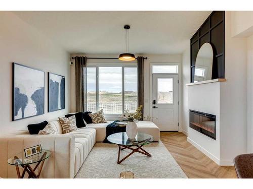 51 Rancher'S View East, Okotoks, AB - Indoor Photo Showing Living Room With Fireplace