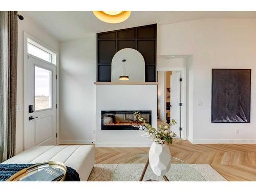 51 Rancher'S View East, Okotoks, AB - Indoor Photo Showing Living Room With Fireplace