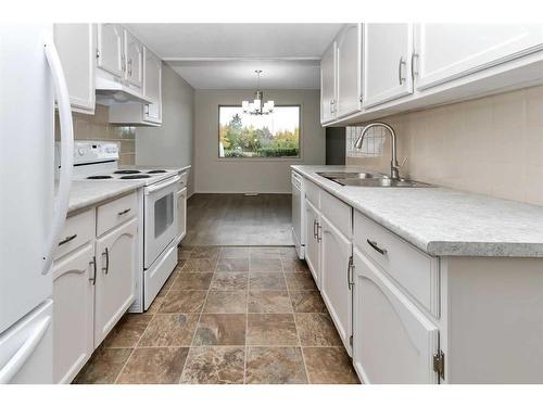 123-54 Bell Street, Red Deer, AB - Indoor Photo Showing Kitchen With Double Sink