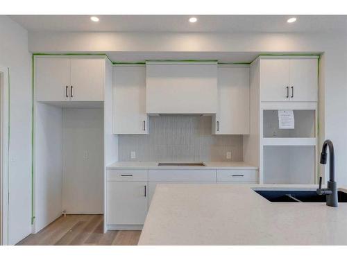 28 Key Cove Sw, Airdrie, AB - Indoor Photo Showing Kitchen With Double Sink