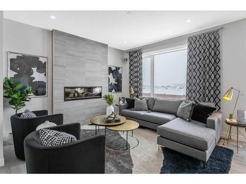 274 Creekstone Hill Sw, Calgary, AB - Indoor Photo Showing Living Room With Fireplace