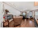 5 Laurel Close, Sylvan Lake, AB  - Indoor Photo Showing Living Room With Fireplace 