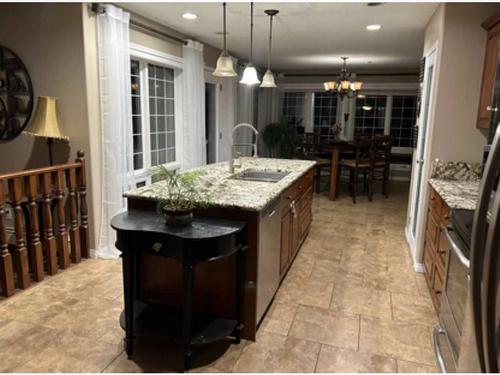 3823 51 Avenue Close, Ponoka, AB - Indoor Photo Showing Kitchen With Double Sink