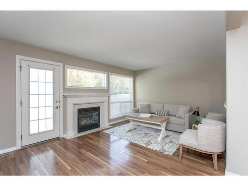 57-73 Addington Drive, Red Deer, AB - Indoor Photo Showing Living Room With Fireplace