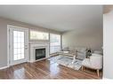 57-73 Addington Drive, Red Deer, AB  - Indoor Photo Showing Living Room With Fireplace 