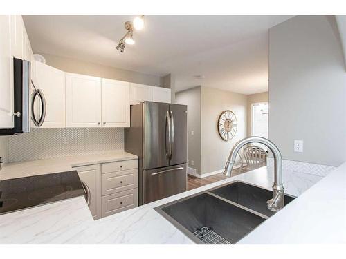 57-73 Addington Drive, Red Deer, AB - Indoor Photo Showing Kitchen With Double Sink