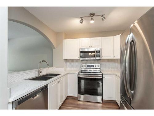 57-73 Addington Drive, Red Deer, AB - Indoor Photo Showing Kitchen With Double Sink