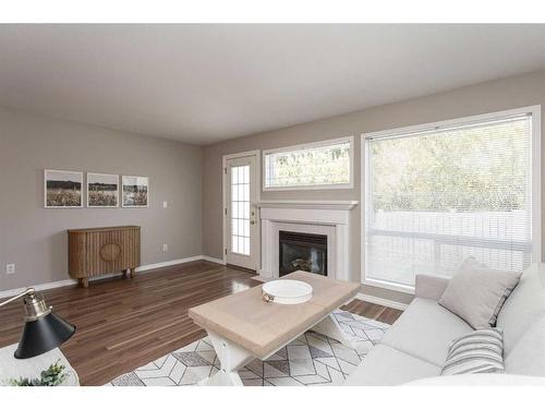 57-73 Addington Drive, Red Deer, AB - Indoor Photo Showing Living Room With Fireplace