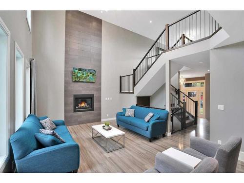 4 Cranna Place, Lacombe, AB - Indoor Photo Showing Living Room With Fireplace