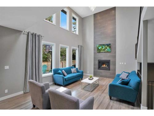 4 Cranna Place, Lacombe, AB - Indoor Photo Showing Living Room With Fireplace