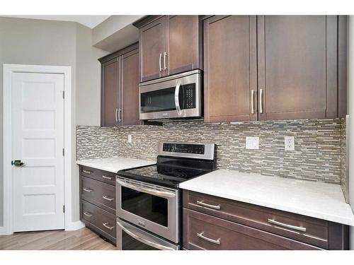 4 Cranna Place, Lacombe, AB - Indoor Photo Showing Kitchen With Upgraded Kitchen