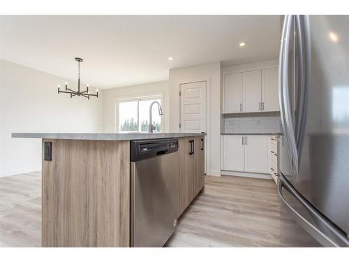 52 Trinity Street, Lacombe, AB - Indoor Photo Showing Kitchen With Stainless Steel Kitchen