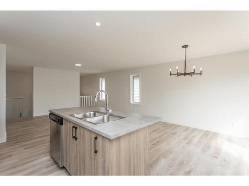 52 Trinity Street, Lacombe, AB - Indoor Photo Showing Kitchen With Double Sink