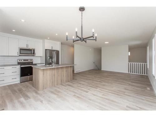 52 Trinity Street, Lacombe, AB - Indoor Photo Showing Kitchen With Stainless Steel Kitchen With Upgraded Kitchen