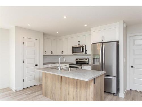 52 Trinity Street, Lacombe, AB - Indoor Photo Showing Kitchen With Stainless Steel Kitchen With Upgraded Kitchen