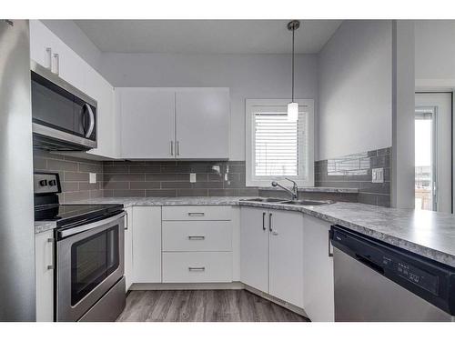 158 Hampton Close, Penhold, AB - Indoor Photo Showing Kitchen With Stainless Steel Kitchen With Double Sink