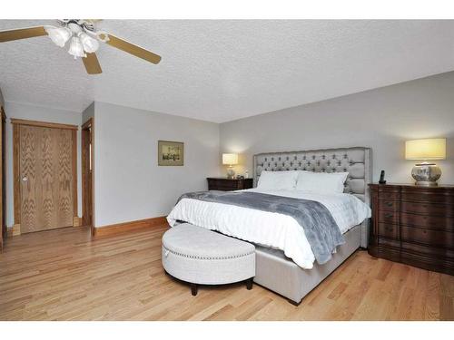 15 Rustic Crescent, Norglenwold, AB - Indoor Photo Showing Bedroom