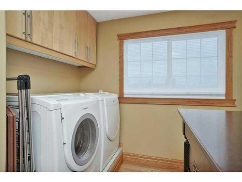 15 Rustic Crescent, Norglenwold, AB - Indoor Photo Showing Laundry Room