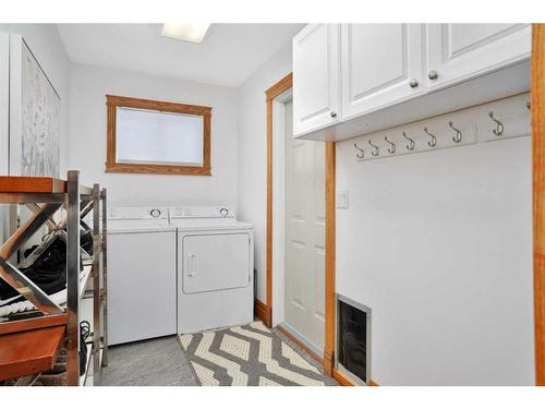 15 Rustic Crescent, Norglenwold, AB - Indoor Photo Showing Laundry Room