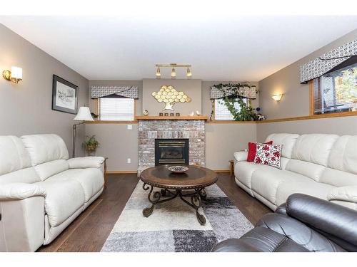 9 Dandell Close, Red Deer, AB - Indoor Photo Showing Living Room With Fireplace