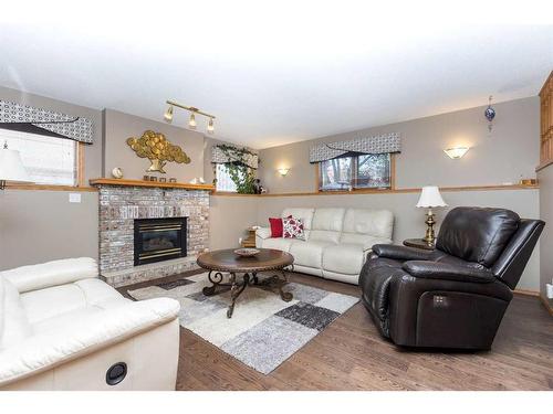 9 Dandell Close, Red Deer, AB - Indoor Photo Showing Living Room With Fireplace