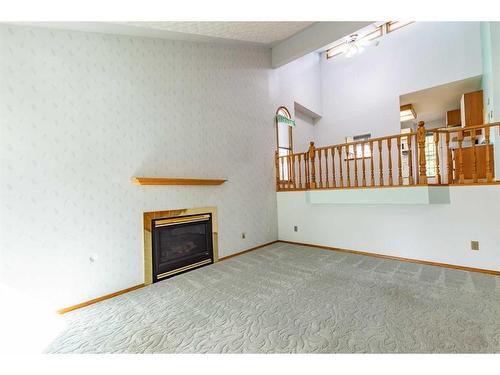 4907 53 Street, Stettler, AB - Indoor With Fireplace