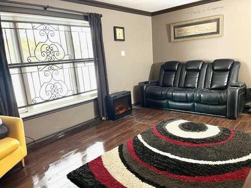 4 Selkirk Avenue, Hughenden, AB - Indoor Photo Showing Living Room With Fireplace