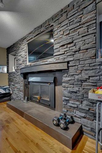 27 Kirby Street, Red Deer, AB - Indoor Photo Showing Other Room With Fireplace