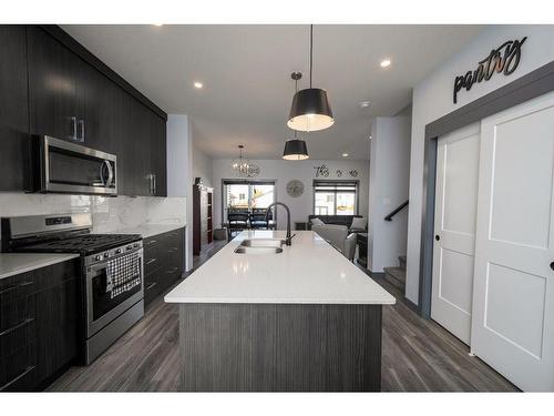 26 Earl Close, Red Deer, AB - Indoor Photo Showing Kitchen With Double Sink With Upgraded Kitchen