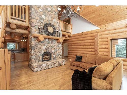 32022 Township Road 440, Rural Ponoka County, AB - Indoor Photo Showing Living Room With Fireplace