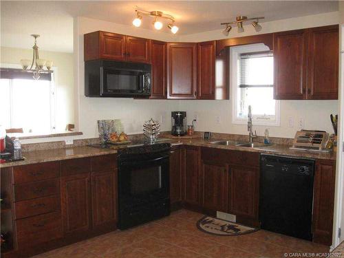 4021-25054 South Pine Lake Road, Rural Red Deer County, AB - Indoor Photo Showing Kitchen With Double Sink