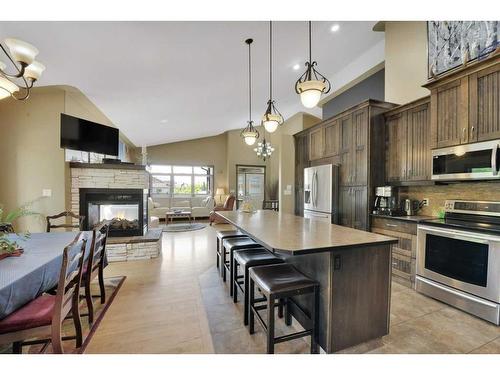 19 Oberg Court, Red Deer, AB - Indoor Photo Showing Kitchen With Fireplace With Stainless Steel Kitchen With Upgraded Kitchen