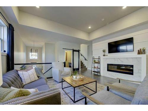 24 Lundberg Crescent, Red Deer, AB - Indoor Photo Showing Living Room With Fireplace