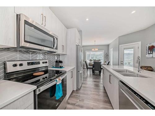 51 Ellington Crescent, Red Deer, AB - Indoor Photo Showing Kitchen With Stainless Steel Kitchen With Double Sink With Upgraded Kitchen